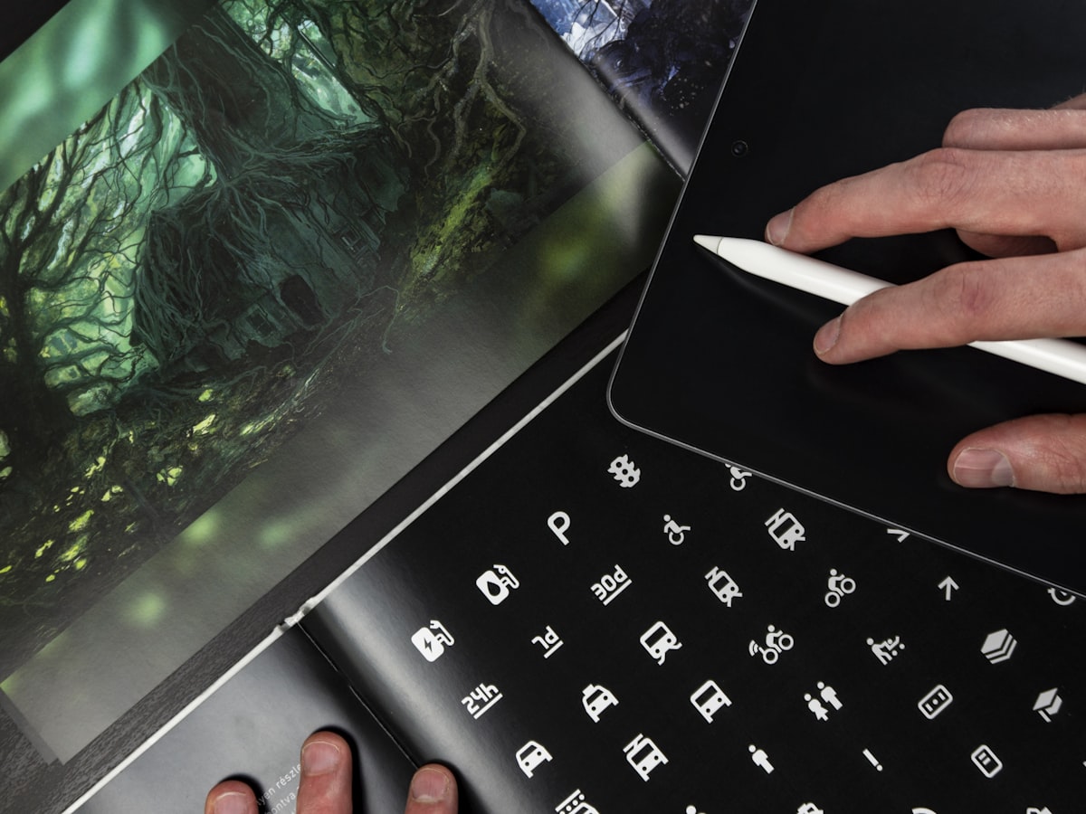 Keyboard and notes on a dark desk